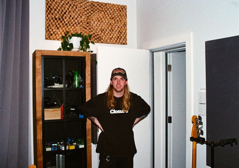 Aodhan in the studio: someone in a cap standing in the studio doorway