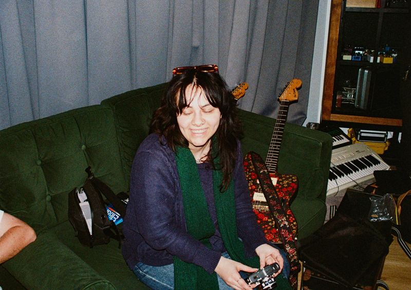 Aodhan in the studio: laughing on the green studio couch