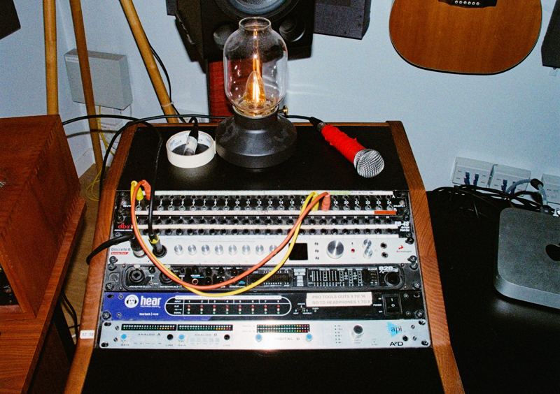 Aodhan in the studio: a rack of studio outboard gear with a lamp on top