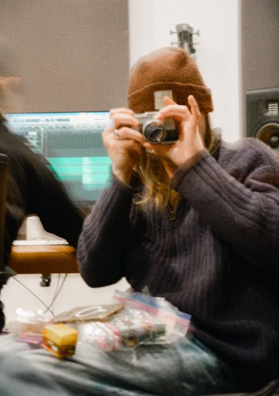 Aodhan in the studio: someone in a beanie photographing the photographer