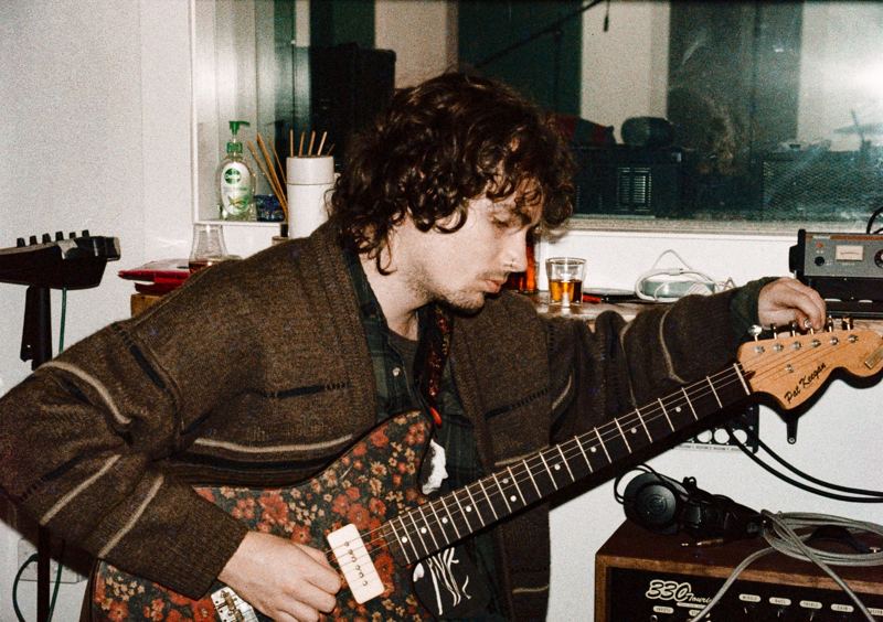 Aodhan in the studio: bassist tuning a paisley bass